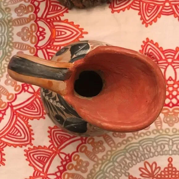 Antique hand painted pottery pitcher
